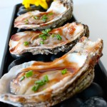 Wood Grilled Oysters with a Smoky BBQ Sauce