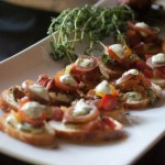 Fresh Burrata and Heirloom Tomato Salad with Basil Cream on Crostini